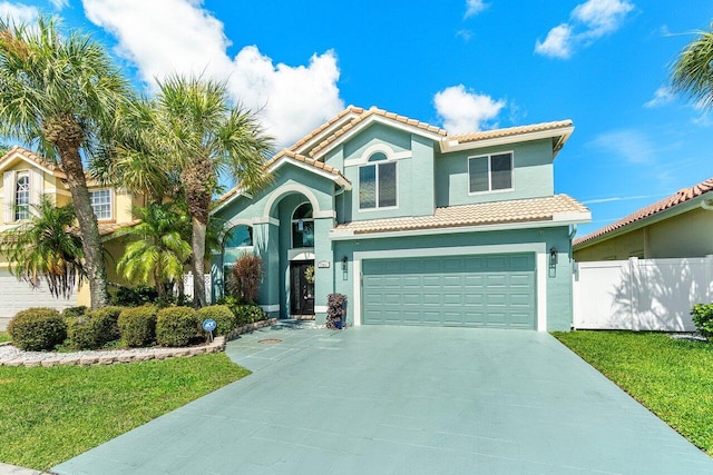 7141 Charleston Point Dr, Lake Worth, FL 33467 - mediterranean / spanish house featuring a tiled roof, an attached garage, concrete driveway, and stucco siding