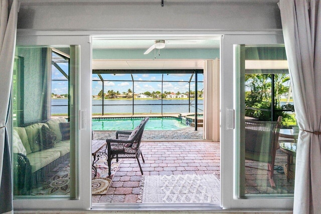 7141 Charleston Point Dr, Lake Worth, FL 33467 - sunroom with a hot tub, a water view, a ceiling fan, and a pool