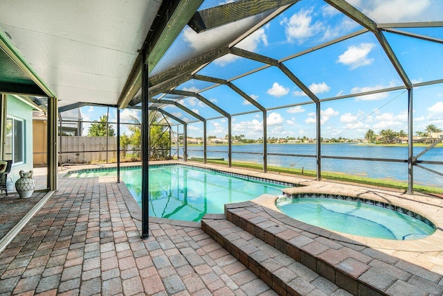 7141 Charleston Point Dr, Lake Worth, FL 33467 - view of pool with a water view, a patio area, a pool with connected hot tub, and glass enclosure