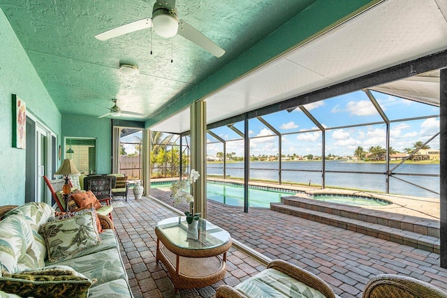 7141 Charleston Point Dr, Lake Worth, FL 33467 - sunroom featuring ceiling fan, a pool, and a water view