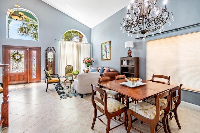 7141 Charleston Point Dr, Lake Worth, FL 33467 - dining room with high vaulted ceiling, a chandelier, and light tile patterned floors