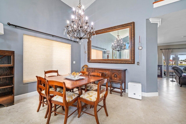 7141 Charleston Point Dr, Lake Worth, FL 33467 - dining area with a chandelier, a high ceiling, and tile patterned floors