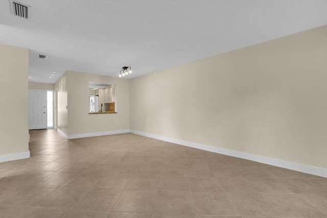 3741 English D Ln Unit D, Lake Worth, FL 33467 - empty room featuring light tile patterned floors and baseboards