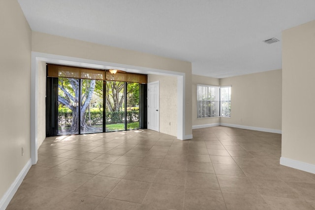 3741 English D Ln Unit D, Lake Worth, FL 33467 - spare room featuring tile patterned floors and baseboards