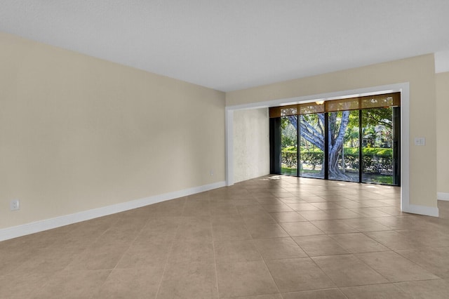 3741 English D Ln Unit D, Lake Worth, FL 33467 - spare room with baseboards and tile patterned flooring