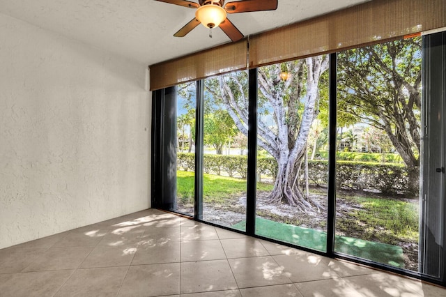 3741 English D Ln Unit D, Lake Worth, FL 33467 - unfurnished sunroom with a textured wall, plenty of natural light, and tile patterned floors