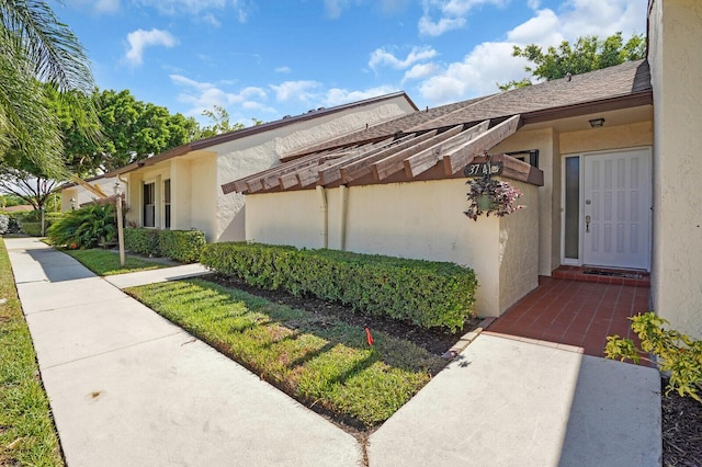 3741 English D Ln Unit D, Lake Worth, FL 33467 - view of exterior entry featuring stucco siding
