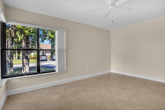 3741 English D Ln Unit D, Lake Worth, FL 33467 - tiled spare room with a ceiling fan and a textured ceiling