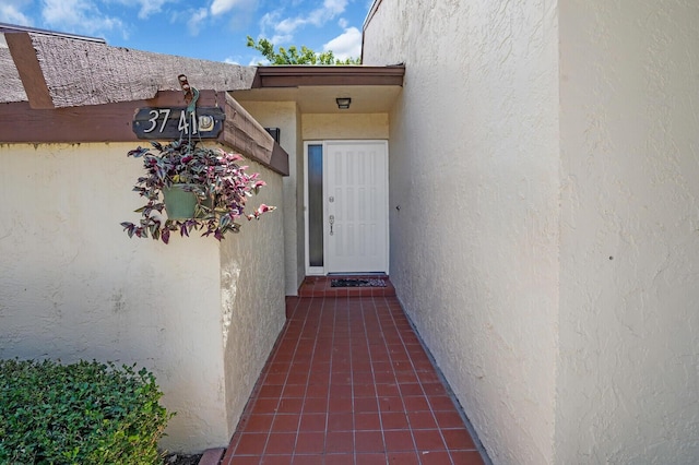 3741 English D Ln Unit D, Lake Worth, FL 33467 - view of exterior entry featuring stucco siding