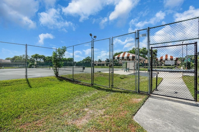 3741 English D Ln Unit D, Lake Worth, FL 33467 - view of tennis court featuring a gate