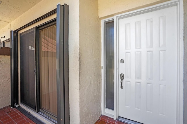 3741 English D Ln Unit D, Lake Worth, FL 33467 - doorway to property with stucco siding