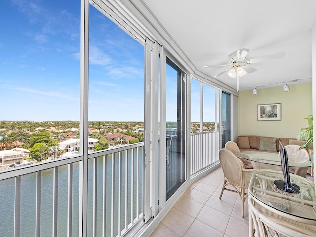 3310 S Ocean Blvd Unit 928D, Highland Beach, FL 33487 - sunroom / solarium featuring tile patterned floors, track lighting, and a water view