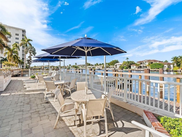 3310 S Ocean Blvd Unit 928D, Highland Beach, FL 33487 - view of patio with a water view and outdoor dining area