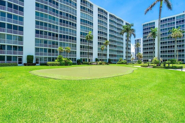 3310 S Ocean Blvd Unit 928D, Highland Beach, FL 33487 - view of property's community with a putting area and a yard