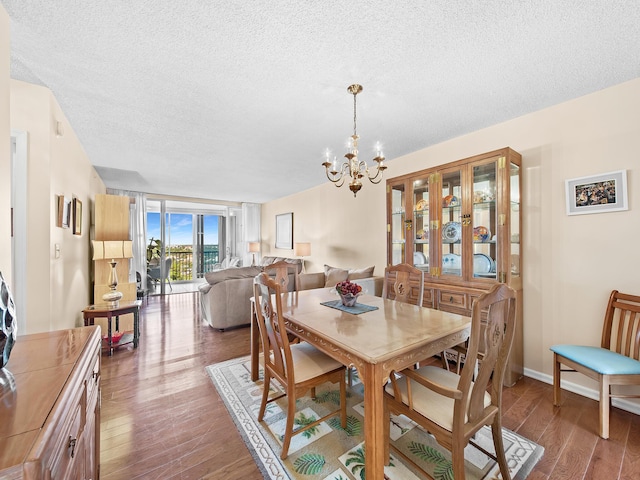 3310 S Ocean Blvd Unit 928D, Highland Beach, FL 33487 - dining room with a textured ceiling, wood finished floors, and a chandelier