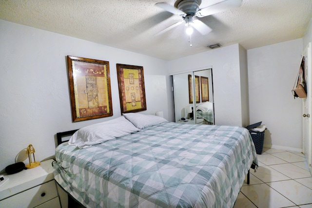 1395 SW 46 Th Ave, Fort Lauderdale, FL 33317 - bedroom with a textured ceiling, a closet, light tile patterned floors, and a ceiling fan