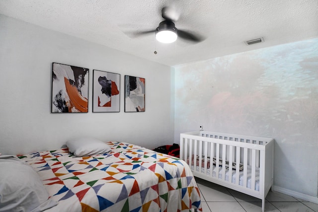 1395 SW 46 Th Ave, Fort Lauderdale, FL 33317 - tiled bedroom featuring a textured ceiling and a ceiling fan