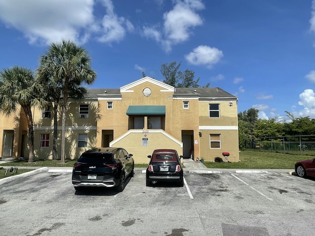2401 NW 56th Ave Unit 3-103, Lauderhill, FL 33313 - view of property featuring uncovered parking