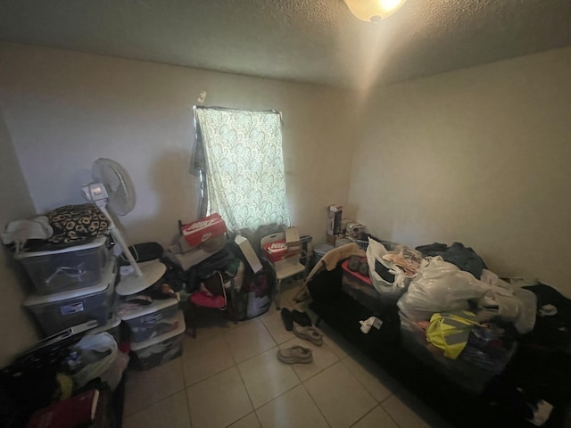 2401 NW 56th Ave Unit 3-103, Lauderhill, FL 33313 - tiled bedroom featuring a textured ceiling