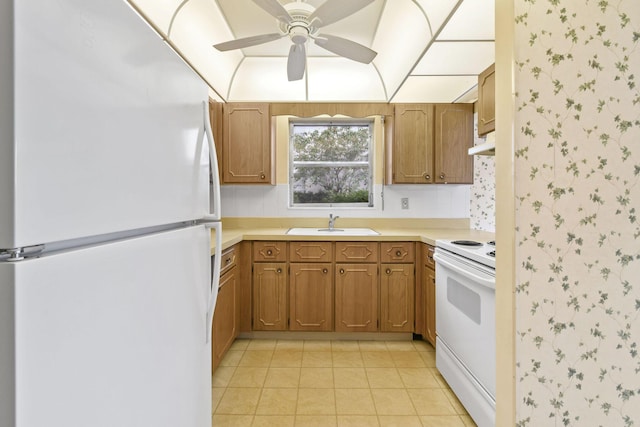 1900 S Kanner Hwy Unit 3-108, Stuart, FL 34994 - kitchen featuring white appliances, wallpapered walls, ceiling fan, brown cabinetry, and light countertops
