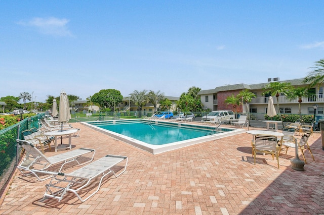1900 S Kanner Hwy Unit 3-108, Stuart, FL 34994 - community pool featuring a patio