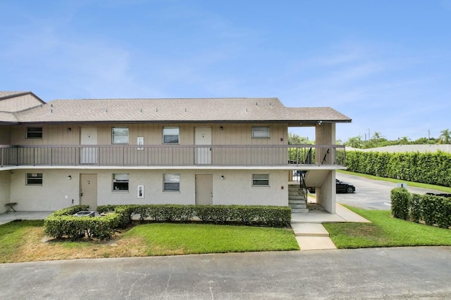 2755 W Atlantic Ave Unit C 212, Delray Beach, FL 33445 - view of property with stairs