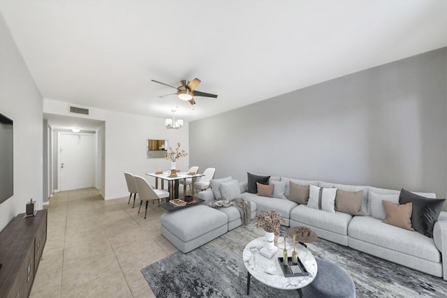 2755 W Atlantic Ave Unit C 212, Delray Beach, FL 33445 - living room with a ceiling fan, light tile patterned floors, and a chandelier