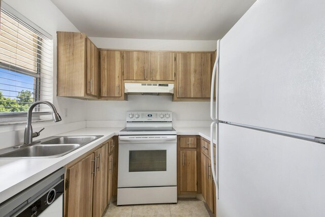 2755 W Atlantic Ave Unit C 212, Delray Beach, FL 33445 - kitchen with white appliances, under cabinet range hood, brown cabinetry, light countertops, and light tile patterned floors