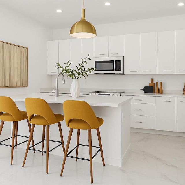 12240 SW 44th Ct, Davie, FL 33330 - kitchen featuring stainless steel microwave, a breakfast bar, light marble finish floors, recessed lighting, and light countertops