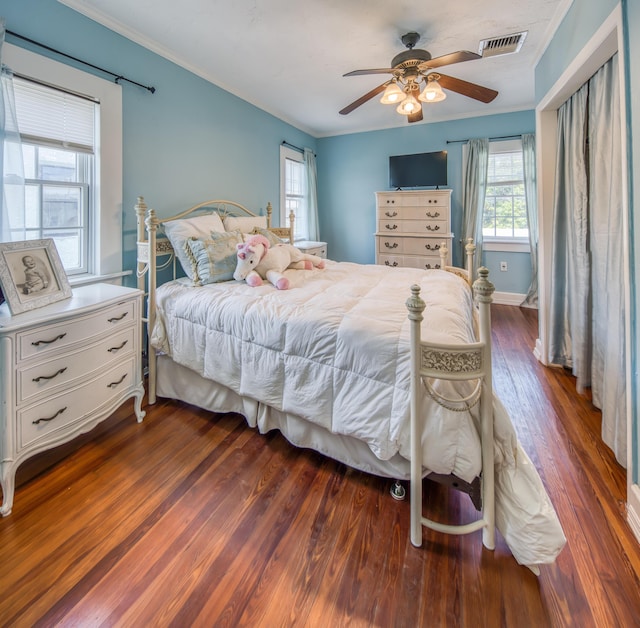 624 10th Ave N, Lake Worth Beach, FL 33460 - bedroom featuring dark wood finished floors, crown molding, and ceiling fan