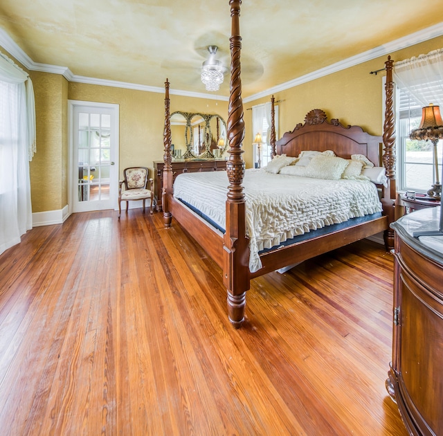 624 10th Ave N, Lake Worth Beach, FL 33460 - bedroom with multiple windows, light wood finished floors, and ornamental molding