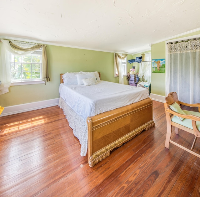 624 10th Ave N, Lake Worth Beach, FL 33460 - bedroom featuring hardwood / wood-style flooring and ornamental molding
