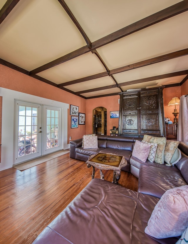 624 10th Ave N, Lake Worth Beach, FL 33460 - living area featuring arched walkways, beam ceiling, french doors, and wood finished floors