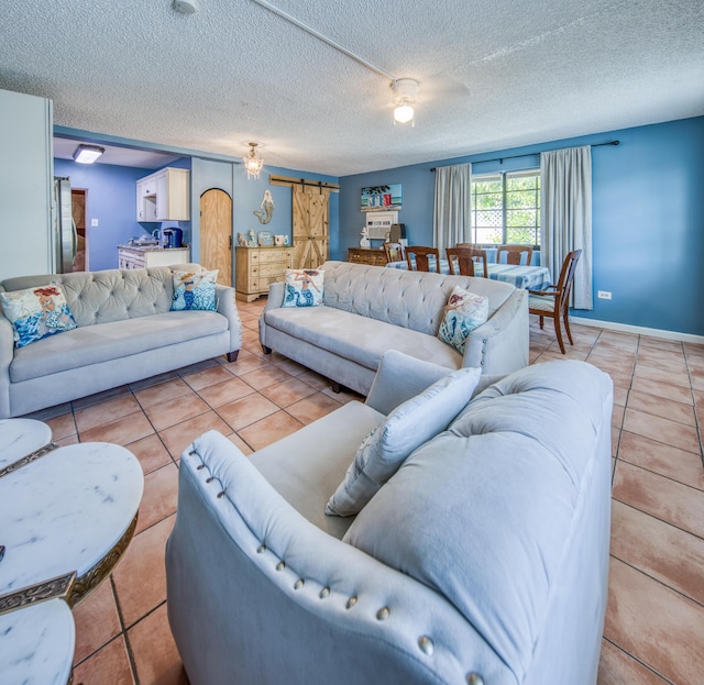624 10th Ave N, Lake Worth Beach, FL 33460 - living room with light tile patterned flooring and a textured ceiling