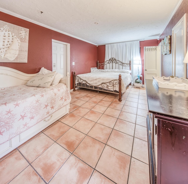 624 10th Ave N, Lake Worth Beach, FL 33460 - bedroom with crown molding, light tile patterned floors, and a textured ceiling