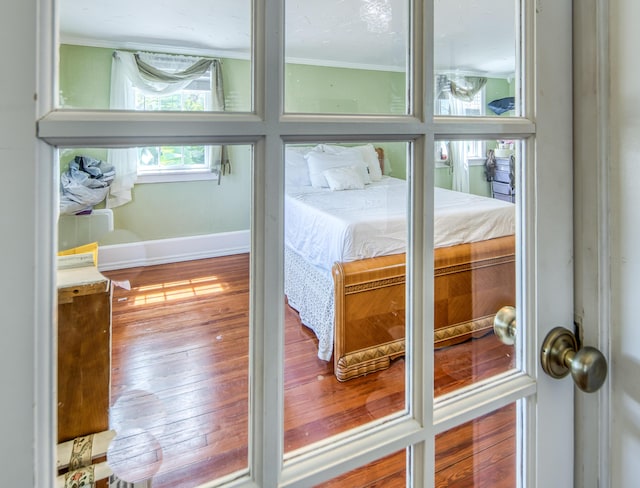 624 10th Ave N, Lake Worth Beach, FL 33460 - bedroom view of crown molding and wood finished floors