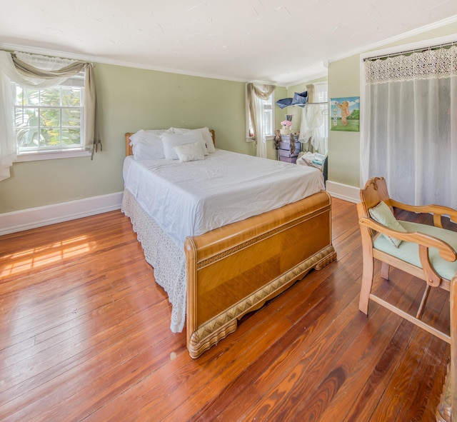 624 10th Ave N, Lake Worth Beach, FL 33460 - bedroom featuring wood-type flooring and crown molding