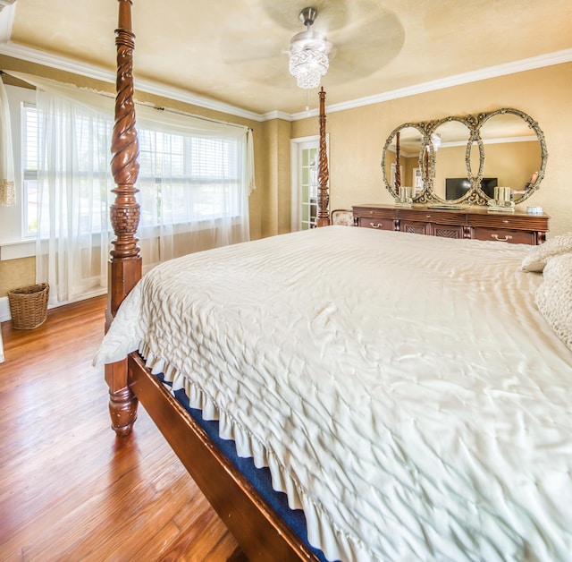 624 10th Ave N, Lake Worth Beach, FL 33460 - bedroom with wood finished floors, multiple windows, ornamental molding, and a ceiling fan
