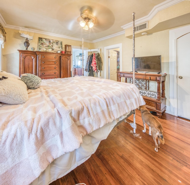 624 10th Ave N, Lake Worth Beach, FL 33460 - bedroom featuring wood finished floors, ornamental molding, and ceiling fan