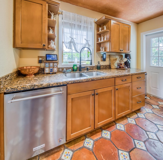 624 10th Ave N, Lake Worth Beach, FL 33460 - kitchen featuring dishwasher, open shelves, brown cabinets, dark stone countertops, and a textured ceiling