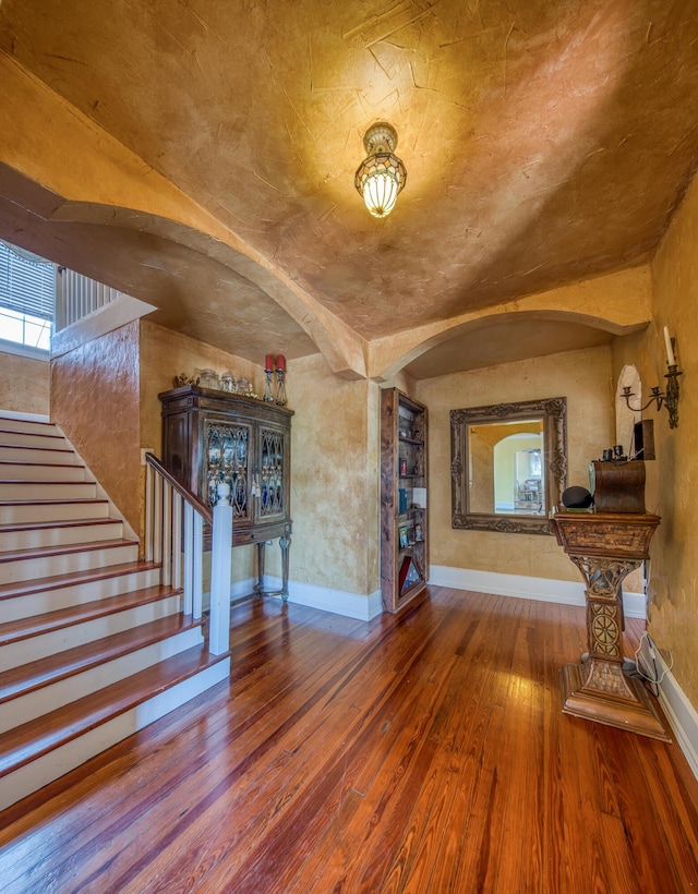 624 10th Ave N, Lake Worth Beach, FL 33460 - entryway with hardwood / wood-style floors, arched walkways, and stairs