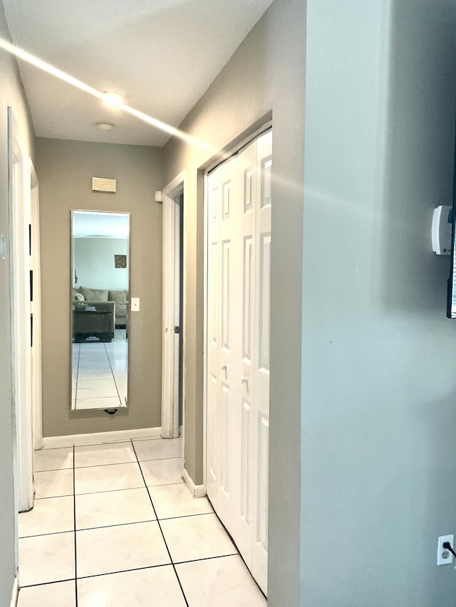 409 NE Oleander Ave, Port Saint Lucie, FL 34952 - corridor featuring light tile patterned floors