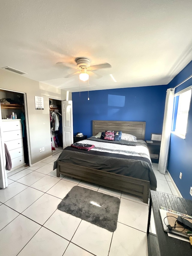 409 NE Oleander Ave, Port Saint Lucie, FL 34952 - tiled bedroom featuring ceiling fan