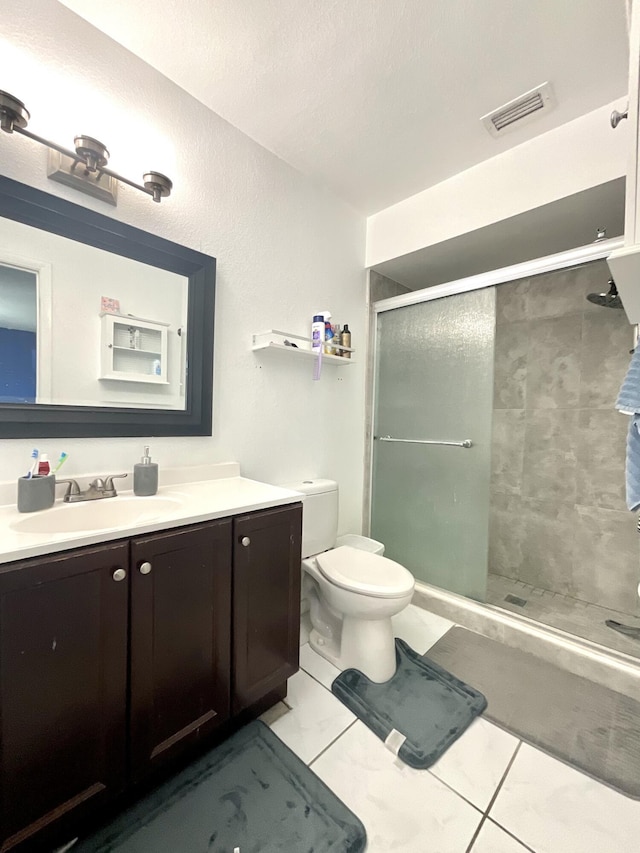 409 NE Oleander Ave, Port Saint Lucie, FL 34952 - bathroom with vanity, a stall shower, and tile patterned floors