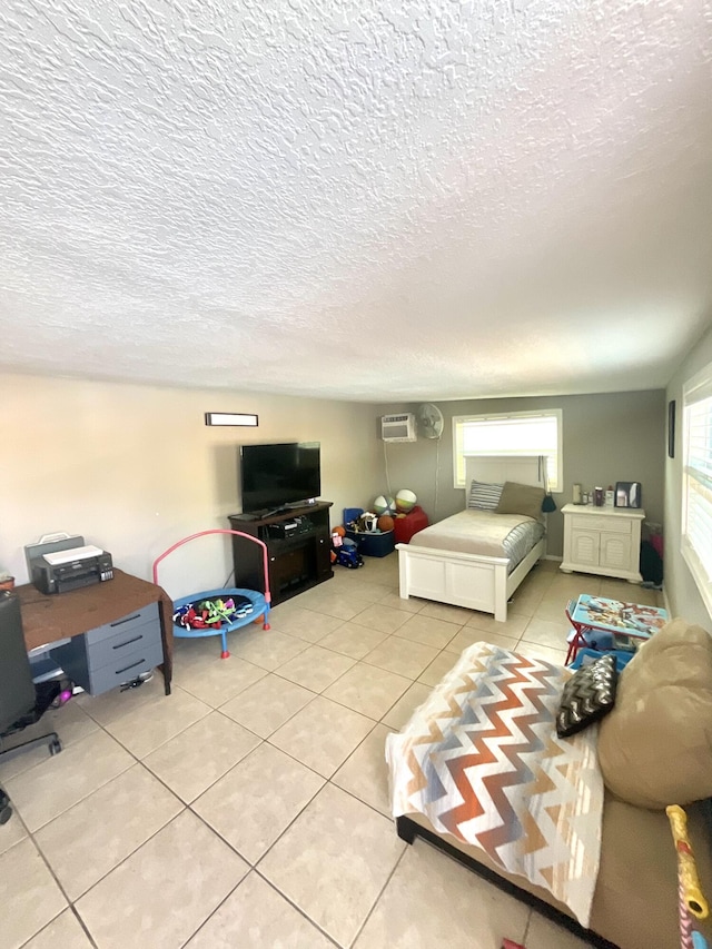 409 NE Oleander Ave, Port Saint Lucie, FL 34952 - tiled bedroom featuring a textured ceiling