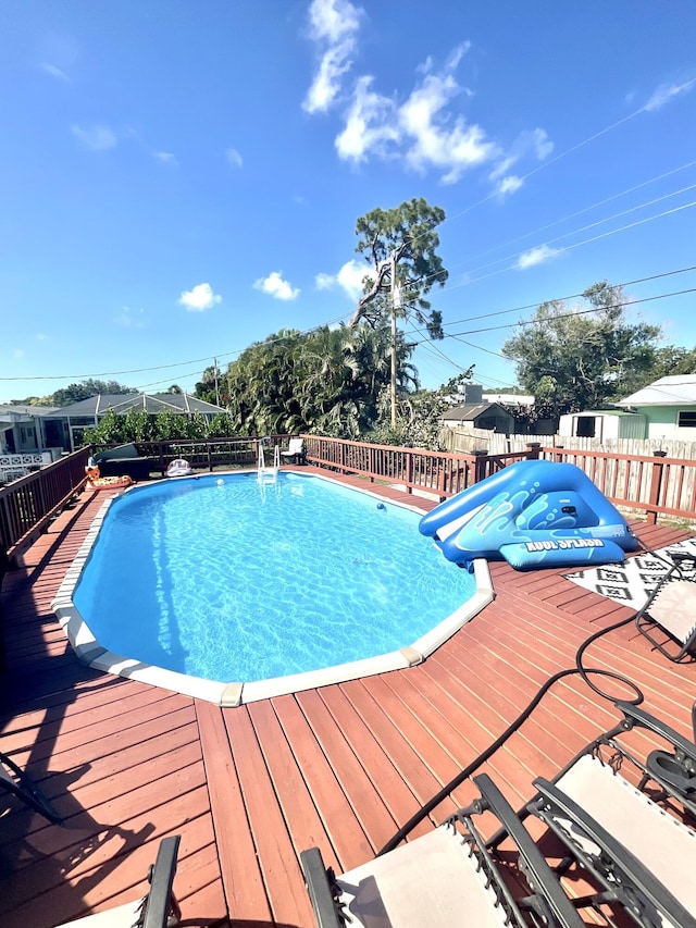 409 NE Oleander Ave, Port Saint Lucie, FL 34952 - view of pool featuring a deck