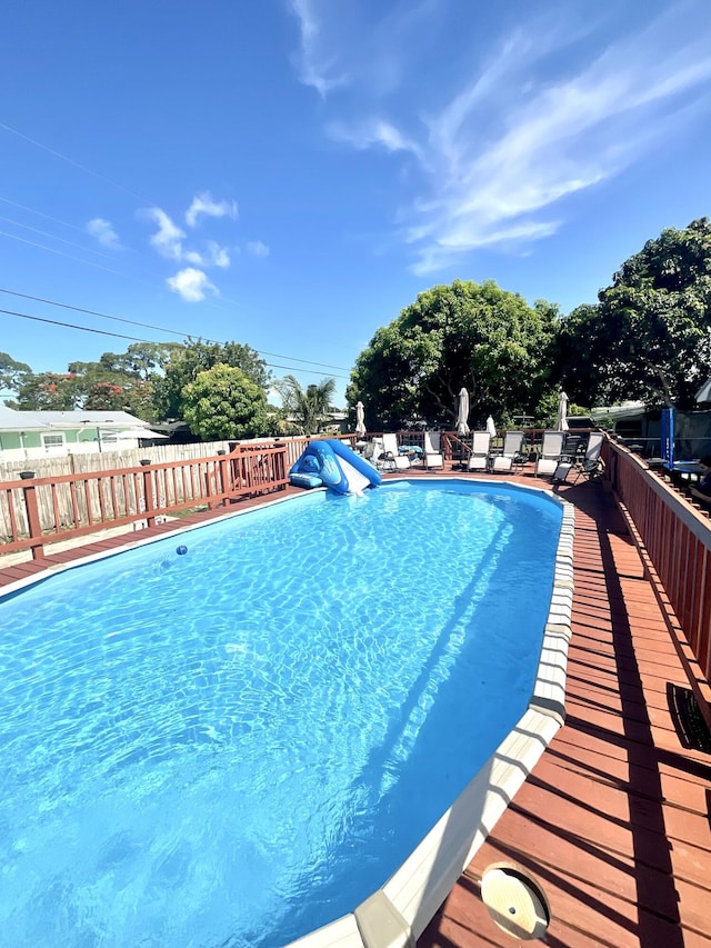 409 NE Oleander Ave, Port Saint Lucie, FL 34952 - view of swimming pool featuring a patio area