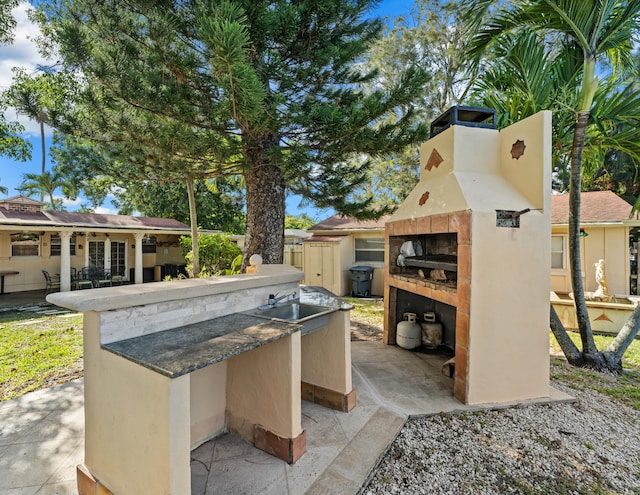 918 Grace Ave, Lake Worth, FL 33461 - view of patio / terrace with a sink and exterior kitchen