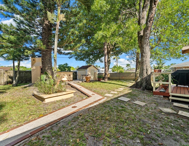 918 Grace Ave, Lake Worth, FL 33461 - fenced backyard with a storage shed and a wooden deck