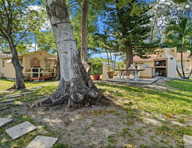 918 Grace Ave, Lake Worth, FL 33461 - view of yard featuring a wooden deck and a patio area
